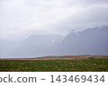 Misty mountain peaks shrouded in thick clouds, Iceland 143469434