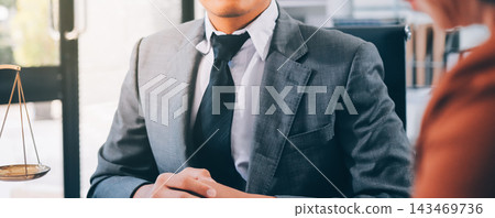 Businessmen or lawyers working together at a meeting, teamwork and partnership. Signing documents, contracts, checking details business agreement 143469736