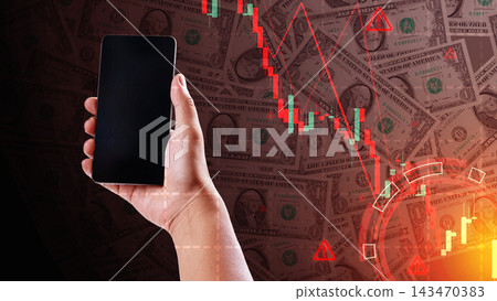 Hand holding a smartphone against a background of US dollar bills with red stock market charts and graphs, representing financial loss, crisis, and trading analysis. Finance and economic concept Hand holding a smartphone against a background of US dollar bills with red stock market charts and graphs, representing financial loss, crisis, and trading analysis. Finance and economic concept 143470383
