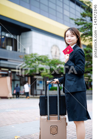 A young businesswoman with a passport A young businesswoman with a passport 143472846