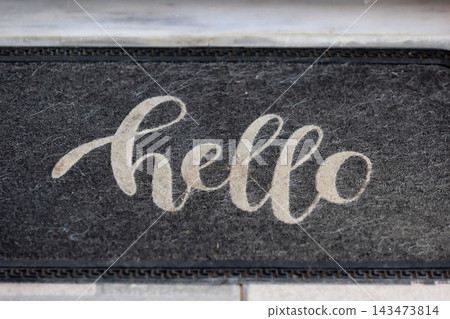 black doormat with white hello text black doormat with white hello text 143473814
