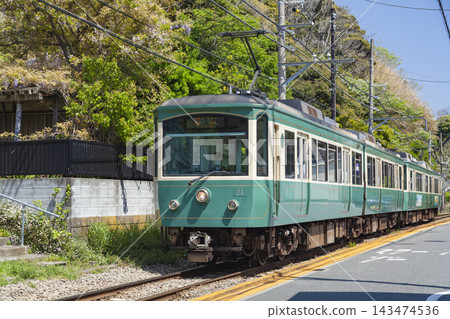 The Enoshima Electric Railway runs through the residential area of Inamuragasaki, Kamakura. The Enoshima Electric Railway runs through the residential area of Inamuragasaki, Kamakura. 143474536