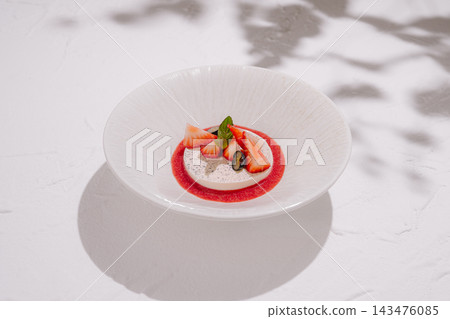 Panna cotta with fresh strawberries and mint Panna cotta with fresh strawberries and mint 143476085