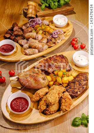 Hearty meat platter serving grilled barbecue feast Hearty meat platter serving grilled barbecue feast 143476434
