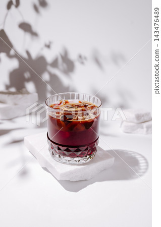 Iced coffee drink on white marble, summer refreshment Iced coffee drink on white marble, summer refreshment 143476489