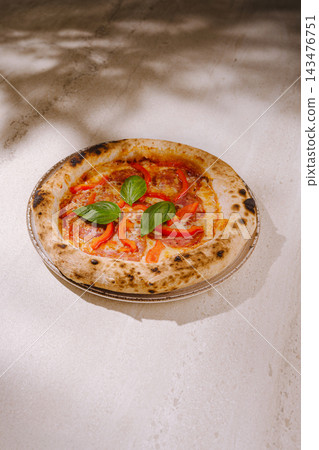 Neapolitan pizza with pepperoni, bell pepper, and basil Neapolitan pizza with pepperoni, bell pepper, and basil 143476751