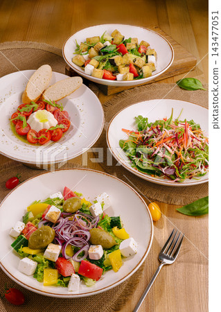 Assortment of fresh healthy vegan and vegetarian salads Assortment of fresh healthy vegan and vegetarian salads 143477051