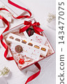 Valentine's day chocolate gift box with red ribbon 143477075
