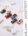 Collecting vintage miniature classic cars on white background 143477077