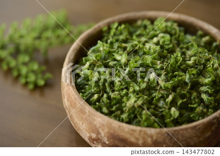 Perilla seeds in a wooden container Perilla seeds in a wooden container 143477802