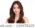 A beautiful young Asian woman with clean, fresh skin against a white background. Skincare, facial treatment, cosmetology, beauty, and spa. An elegant portrait of an Asian woman. 143478329