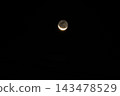 moon floating in the night sky 143478529