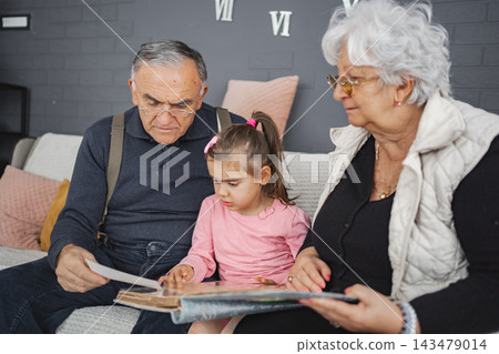 Heartwarming family moments during story time at home Heartwarming family moments during story time at home 143479014