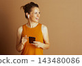 Woman Pointing to Smartphone Screen 143480086