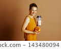 Cheerful Woman with Fall Fitness Drink 143480094