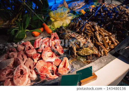 Fresh Seafood and Fish at a Vibrant Market Stall Fresh Seafood and Fish at a Vibrant Market Stall 143480136