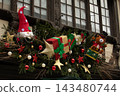 Christmas in Strasbourg, Alsace, France. Festive decorations with Santa gnome, teddy bear and colorful Christmas gifts. 143480744