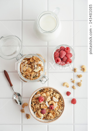 Breakfast ingredients arranged from above on a light tiled background Breakfast ingredients arranged from above on a light tiled background 143481085