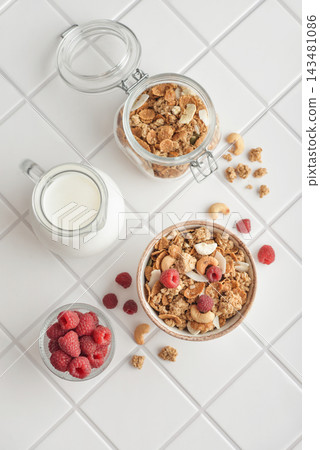 Breakfast ingredients arranged from above on a light tiled background Breakfast ingredients arranged from above on a light tiled background 143481086