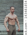 A CrossFit man poses for the camera on a sports 143481854