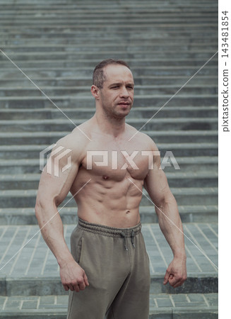 A CrossFit man poses for the camera on a sports 143481854