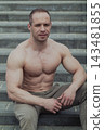 A CrossFit man poses for the camera on a sports 143481855