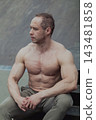 A CrossFit man poses for the camera on a sports 143481858