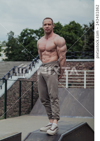 A CrossFit man poses for the camera on a sports 143481862