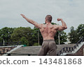 A CrossFit man poses for the camera on a sports 143481868