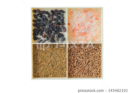 Variety of spices. Barberry, coriander, cumin, and pink salt. Isolated on a white background. Spices for Eastern pilaf. Spice market assortment. Top view. Variety of spices. Barberry, coriander, cumin, and pink salt. Isolated on a white background. Spices for Eastern pilaf. Spice market assortment. Top view. 143482101