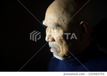 Close-up of an old man's face and expression 143483743