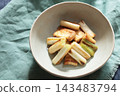 Stir-fried green onions and fried tofu in soy sauce 143483794