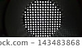 Abstract industrial monochrome background with circular perforated metal grid pattern. 143483868