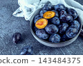 Sweet blue plums on white background 143484375