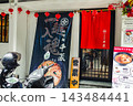 Photos of the exteriors of Japanese ramen restaurants found in Asian cities. 143484441