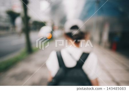 Back view of a woman wearing a cap Back view of a woman wearing a cap 143485083