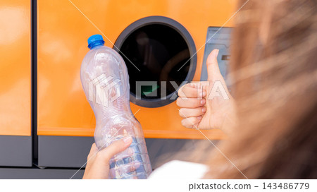 Bottle recycling concept with woman near return station. Bottle recycling concept with woman near return station. 143486779