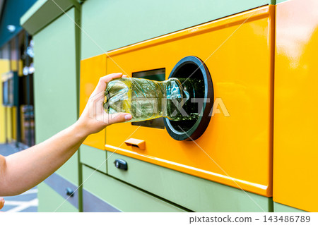 Recycling station collecting bottle through return opening. Recycling station collecting bottle through return opening. 143486789