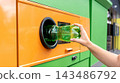 Plastic bottle inserted into reverse vending machine. 143486792