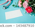 Medical and welfare message card: A blank card surrounded by a pink stethoscope and a bouquet of flowers. 143487910