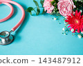 Pink stethoscope and bouquet of flowers - Medical image material 143487912