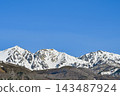 The snow-capped Northern Alps against a clear blue sky, and the spring mountain scenery of Hakuba Village, Nagano Prefecture [Nagano Hakuba Landscape Photography] 143487924