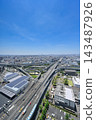 The urban landscape of Osaka's Higashi-Osaka Junction and expressway spreads out under a blue sky [Osaka urban landscape photograph] 143487926