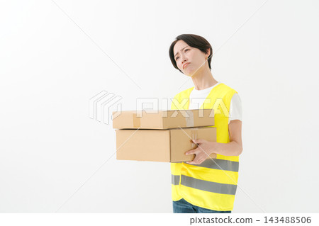 The delivery woman had a displeased look on her face. The delivery woman had a displeased look on her face. 143488506