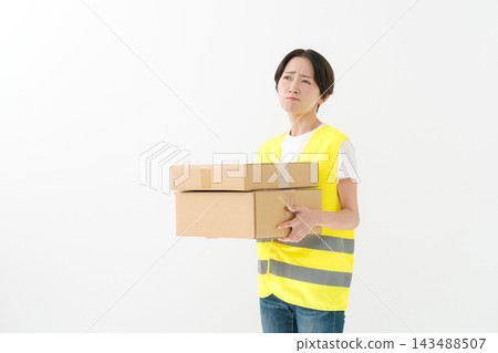 The delivery woman had a displeased look on her face. The delivery woman had a displeased look on her face. 143488507