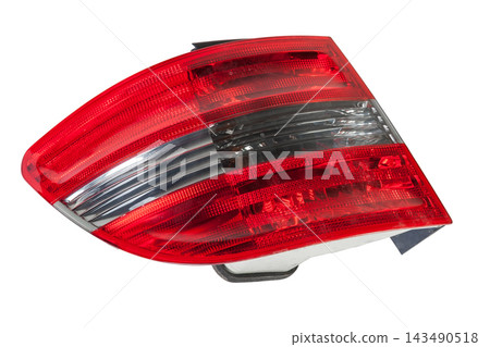 A taillight of a stop signal for a German auto - optical equipment of white and red color on a white isolated background. A spare part for repair and sale in a car service center 143490518