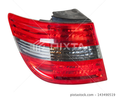 A taillight of a stop signal for a German auto - optical equipment of white and red color on a white isolated background. A spare part for repair and sale in a car service center A taillight of a stop signal for a German auto - optical equipment of white and red color on a white isolated background. A spare part for repair and sale in a car service center 143490519