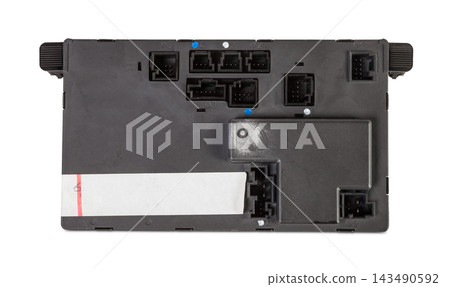 Plastic car engine control unit with metal elements on a white isolated background is the connecting center of various subsystems, units and assemblies. Monitoring the state of the moment. Spare part. Plastic car engine control unit with metal elements on a white isolated background is the connecting center of various subsystems, units and assemblies. Monitoring the state of the moment. Spare part. 143490592
