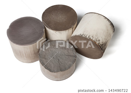 Recycle and purchase of precious non-ferrous metals. Four round and oval ceramic catalysts containing platinum, palladium and rhodium on a white background Recycle and purchase of precious non-ferrous metals. Four round and oval ceramic catalysts containing platinum, palladium and rhodium on a white background 143490722