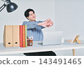A man working at a desk 143491465